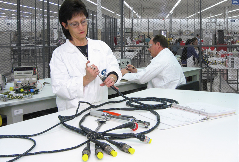 Image of a female employee performing repairs